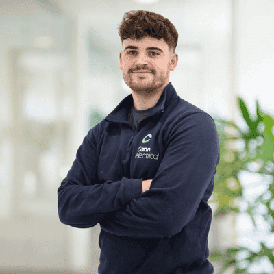 Man in uniform standing confidently indoors